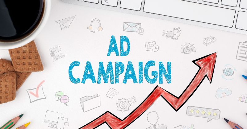 Text graphic reading "Ad Campaign" accompanied by an upward arrow, symbolizing increased sales.