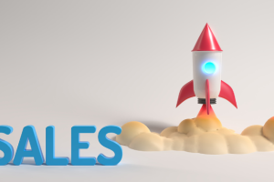 The word "Sales" is depicted in blue letters alongside a launching rocket ship.