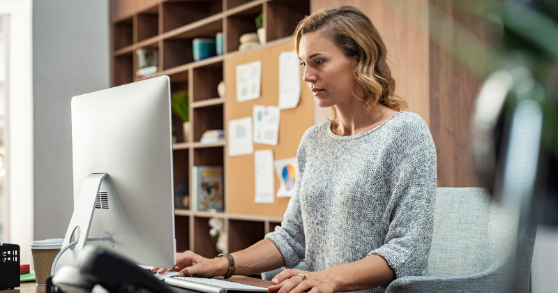 woman using her computer to check her inbox