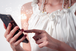 t: woman checking her cellphone and reading some promotional emails